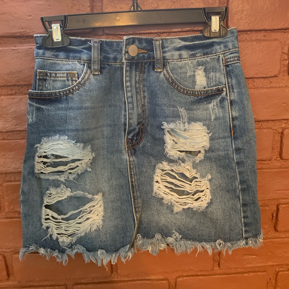 Distressed denim mini skirt
